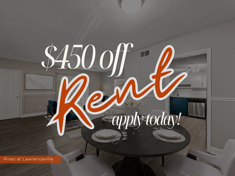 A dining room with a sign offering $450 off rent.