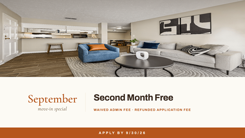 A living room with a couch, chair, and coffee table is advertised as the second month free.