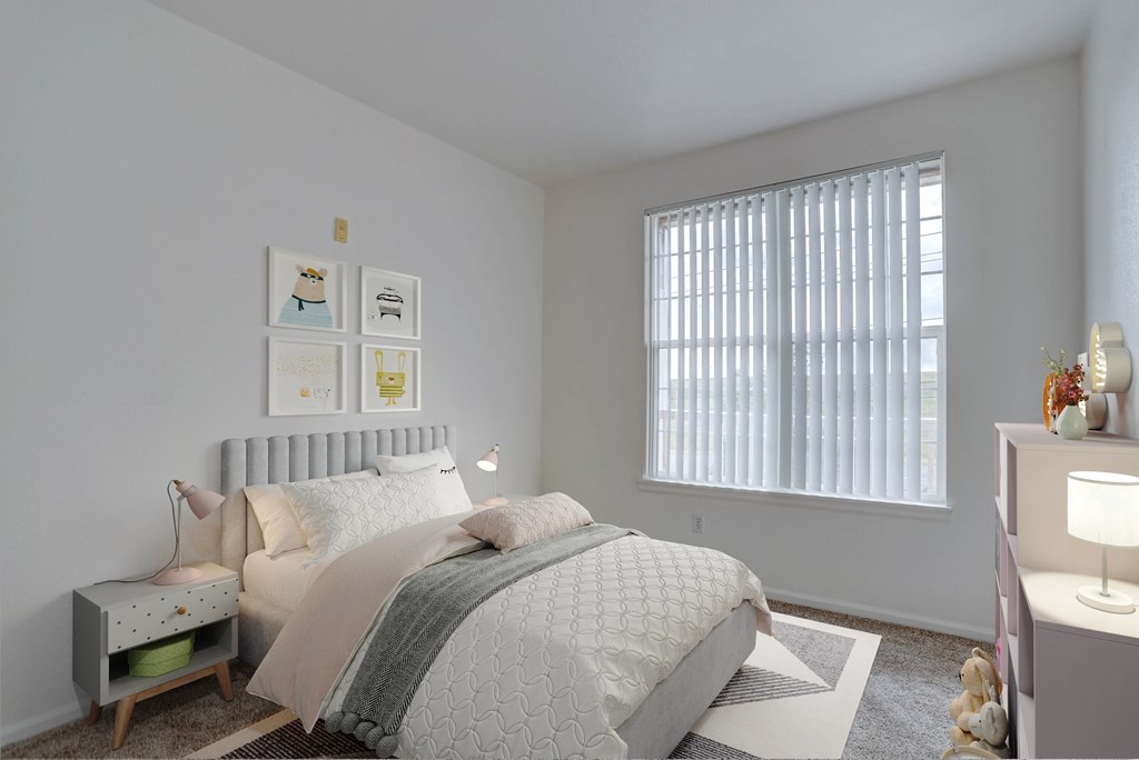 A bedroom with a bed, nightstand, and a window with blinds.