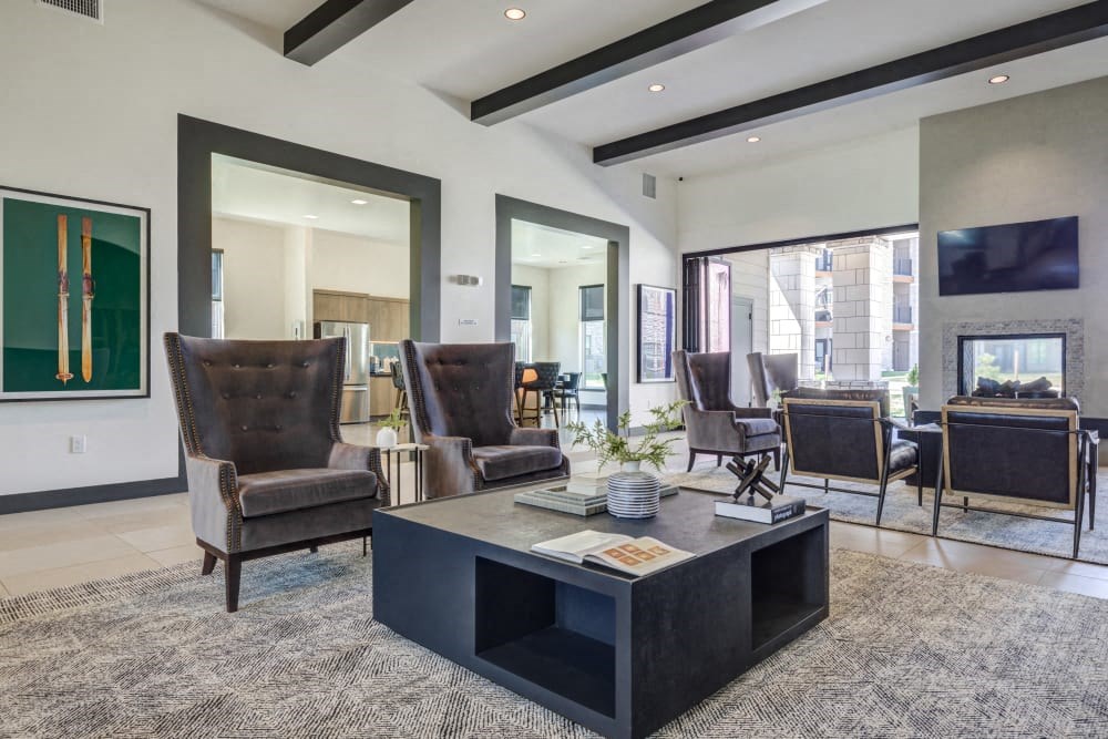 a living room with a fireplace and a coffee table