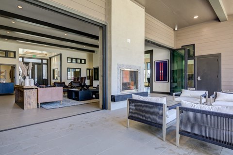 A modern living room with a sofa, a chair, and a coffee table.