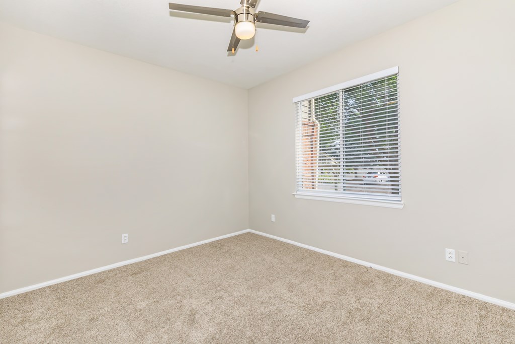 Bedroom with ceiling fan.