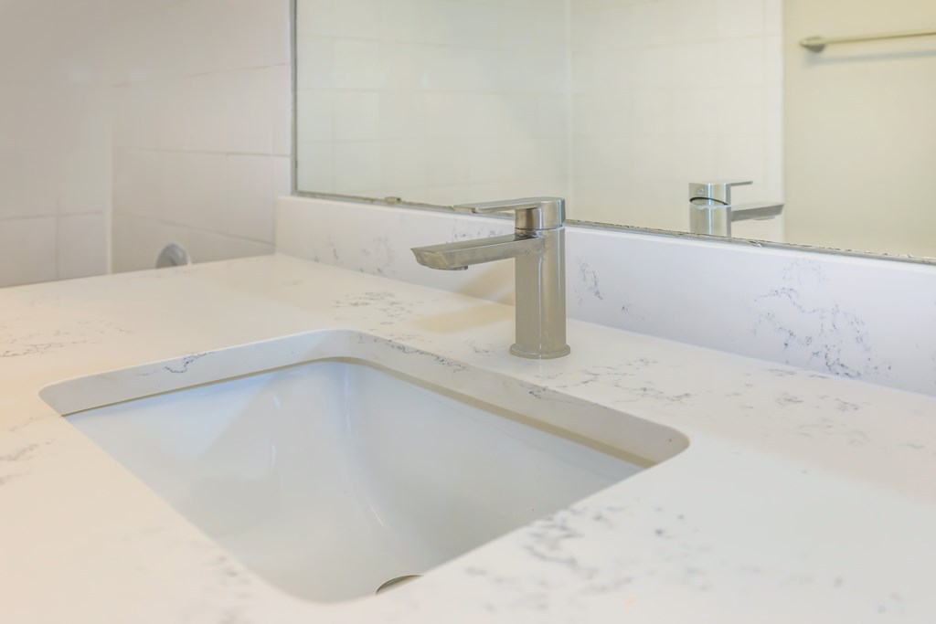 A modern sink with beautiful countertop.