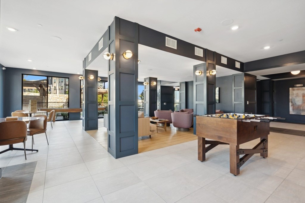 Game room with billiards table and lounge seating area