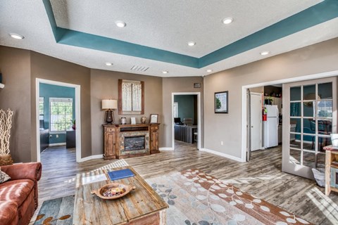 a living room with a fireplace and a table