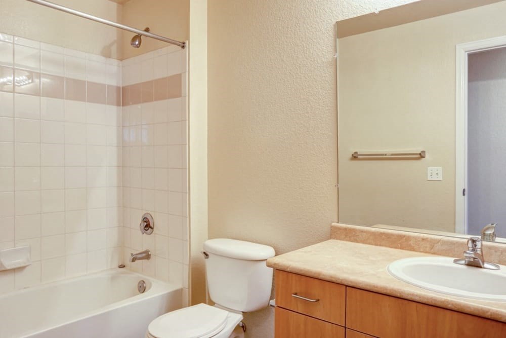a bathroom with a sink toilet and a bath tub