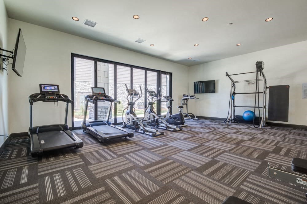 A spacious gym with a variety of exercise equipment.