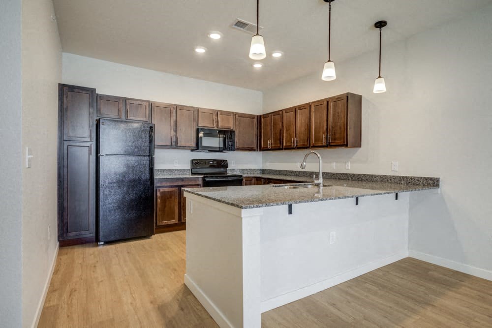 a kitchen with a counter top and a refrigerator