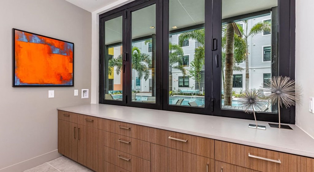 a kitchen with a counter top and a large window