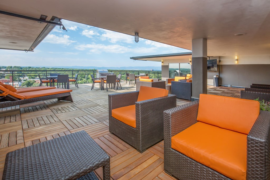 Outdoor lounge area with tables and chairs
