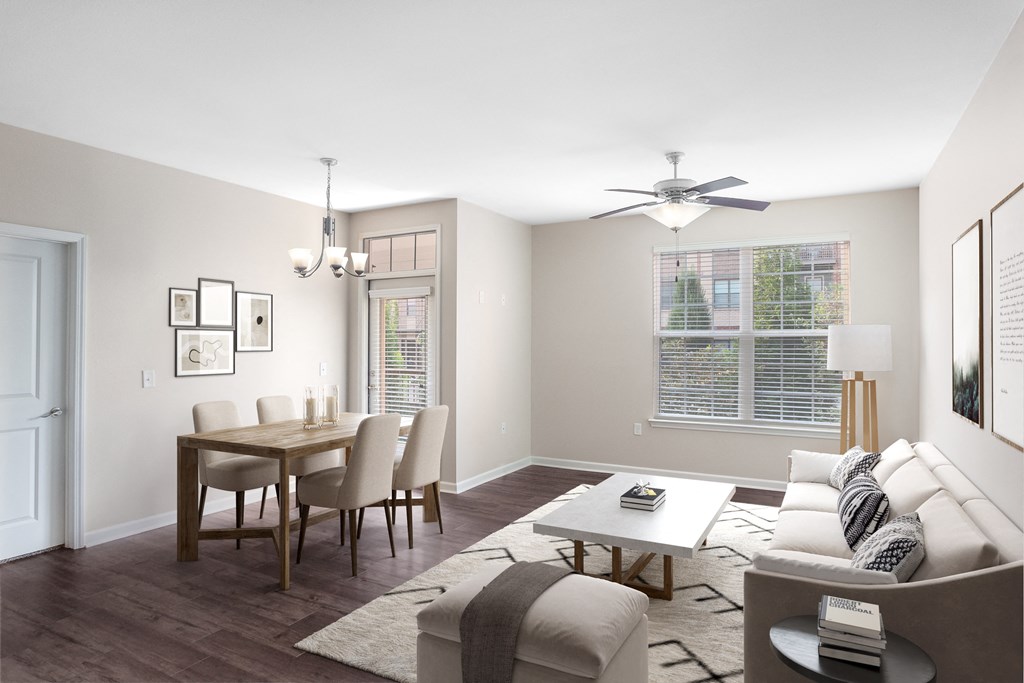 a living room and dining room with a couch and a table