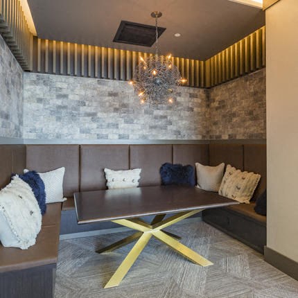 a dining room with a table and a chandelier