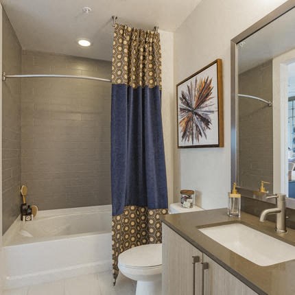 a bathroom with a sink toilet and a bath tub