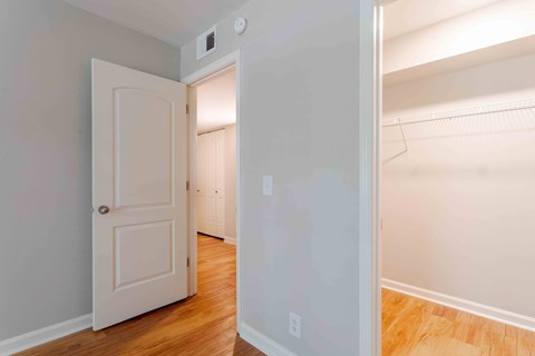 A white door is open to a hallway.