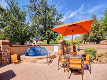 Outdoor seating in front of fountain at Starrview at Starr Pass Apartments in Tucson, AZ