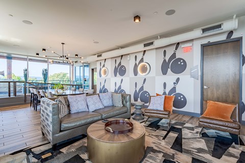 a living room with couches and chairs and a table