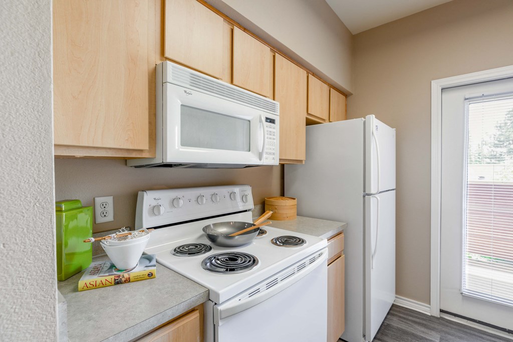a kitchen with a stove microwave and refrigerator