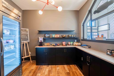 a kitchen with a counter top and a refrigerator