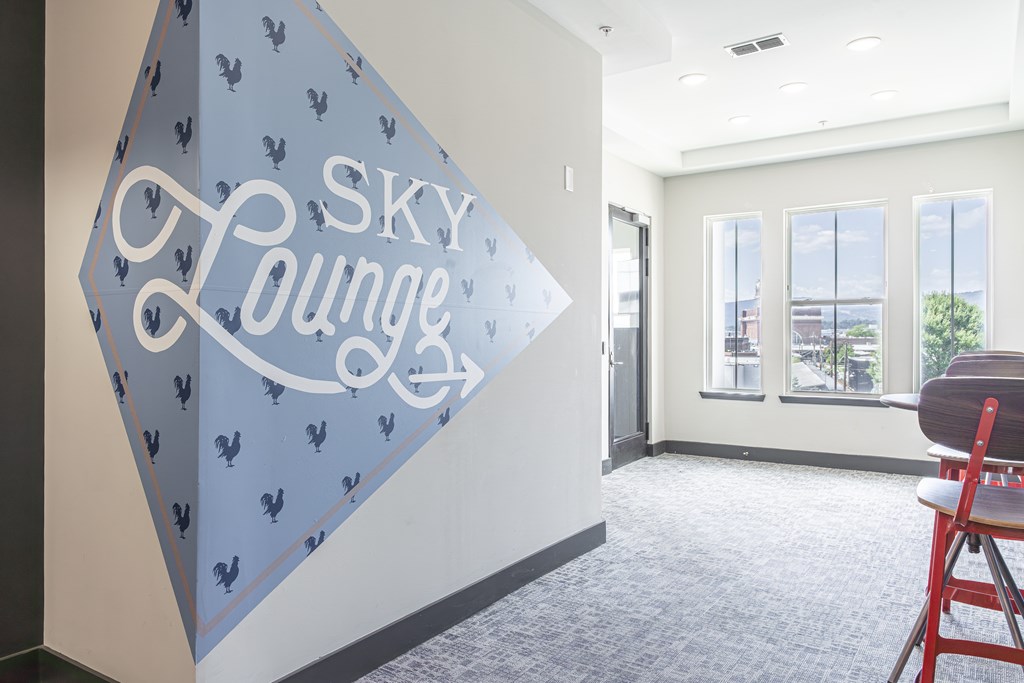 A room with a wall that says Sky Lounge.