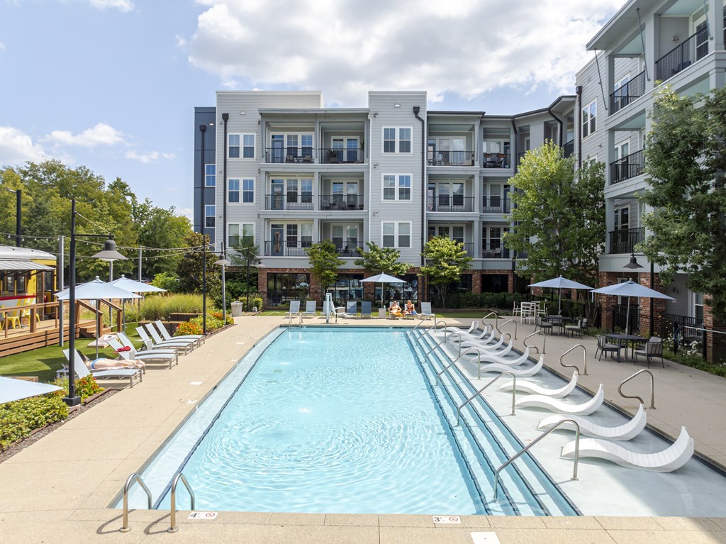 Large swimming pool with in-pool lounge chairs