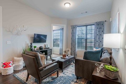 a living room with a couch and a tv