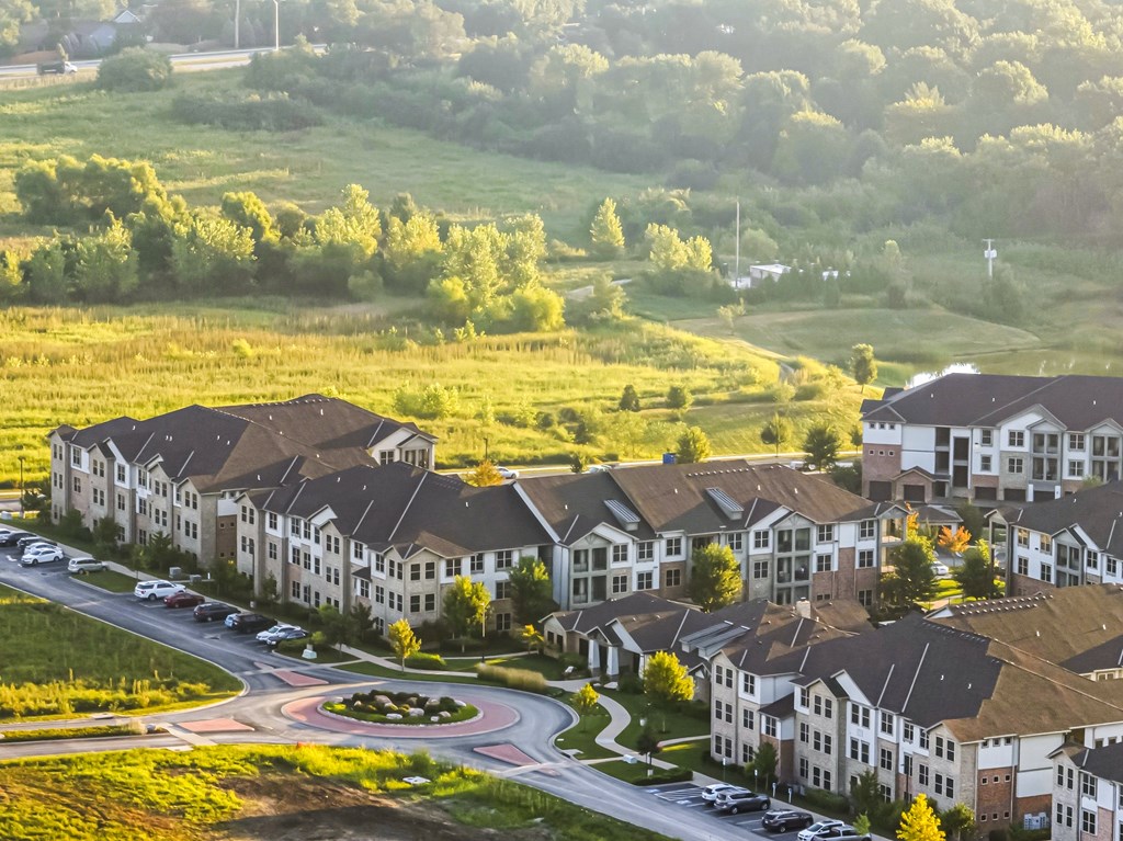 A large building complex with a roundabout in front.