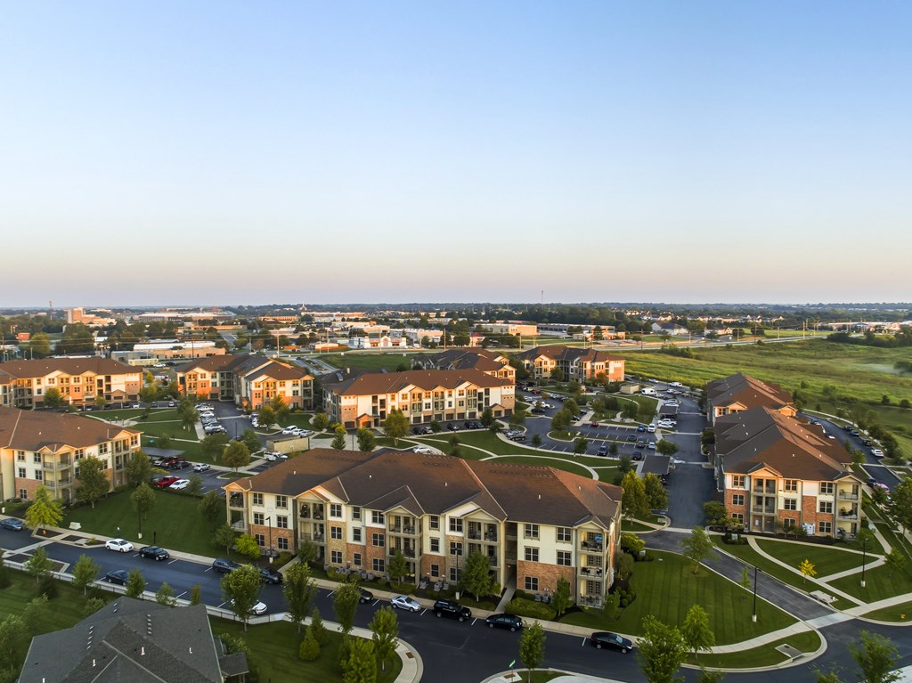 A large apartment complex with multiple buildings and parking lots.