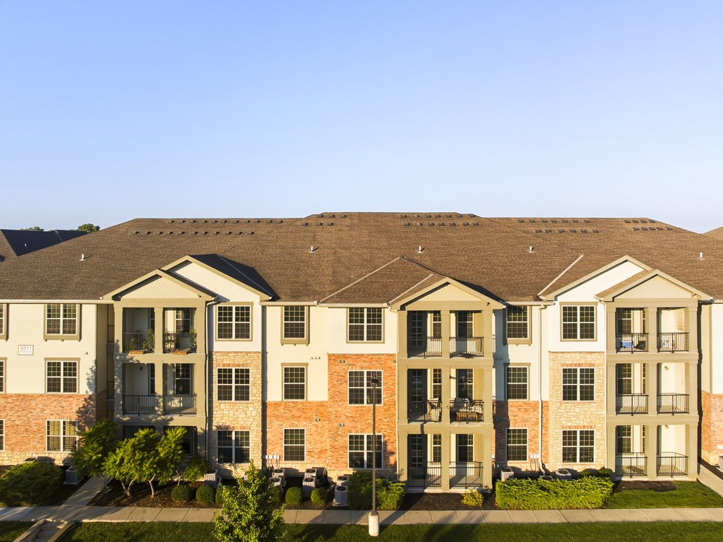 A large apartment complex with multiple buildings and balconies.
