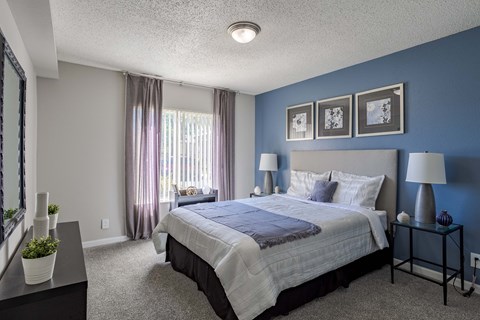 the preserve at ballantyne commons bedroom with large bed and blue walls