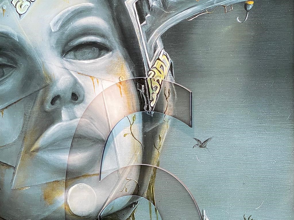 a painting of a face on a wall