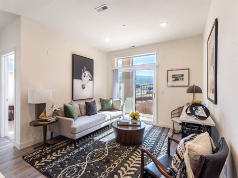 a living room with a couch and a table