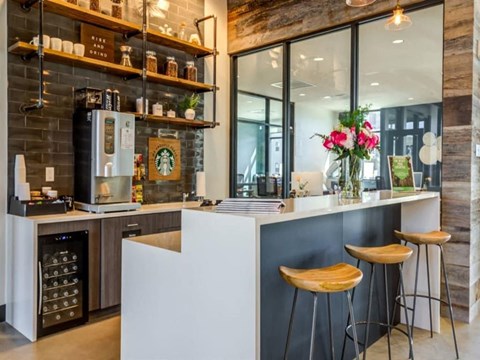 a kitchen with a counter and bar stools