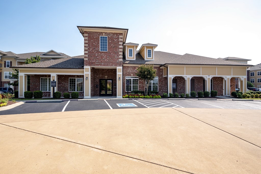 a large parking lot in front of a building