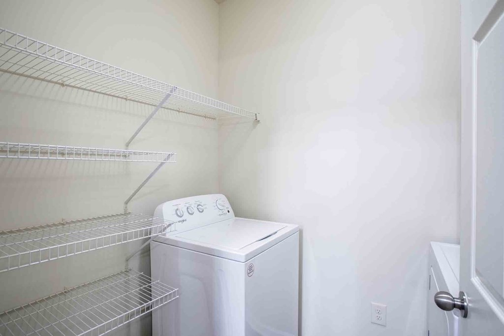 Laundry room wish washer and dryer and built-in shelves