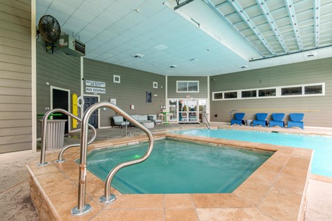 an indoor pool and chairs