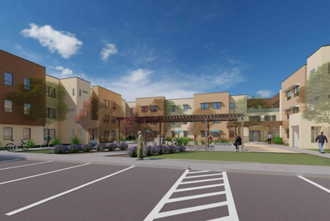 A modern building complex with a pedestrian walkway in front.