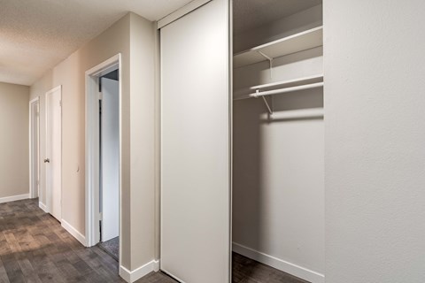 hallway with a closet and a door to the bedroom