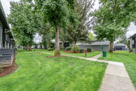 a sidewalk in front of buildings
