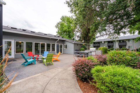 colorful chairs and tables in front of a building