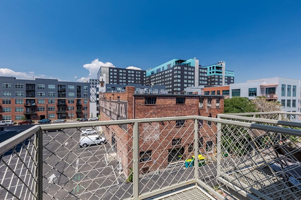 views of the city from the rooftop terrace of an apartment building