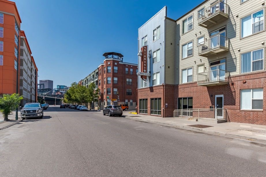 an empty street with buildings on both sides of it