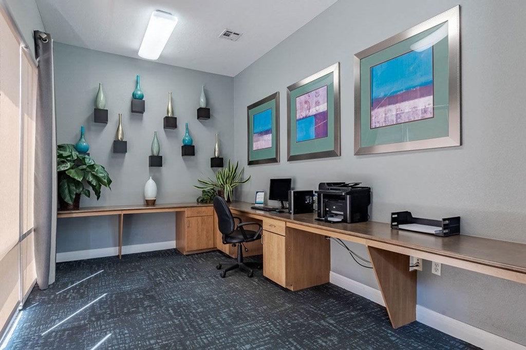 a office with a wooden desk and a computer