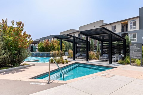 a swimming pool with a building in the background