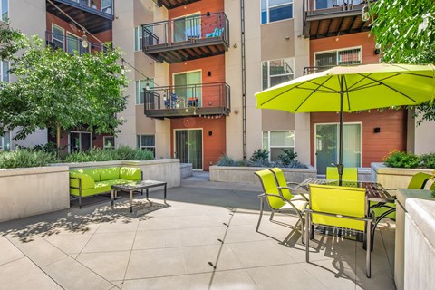 Outdoor resident lounge area with table and chairs