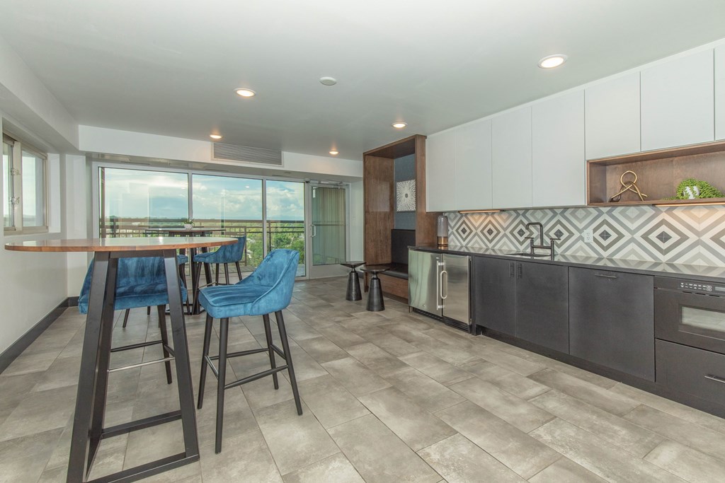 Clubhouse kitchen area with tables and chairs
