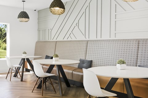 A seating area with modern chairs and tables.