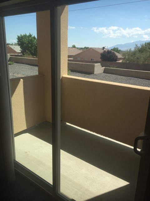 A view from a sliding glass door and balony
