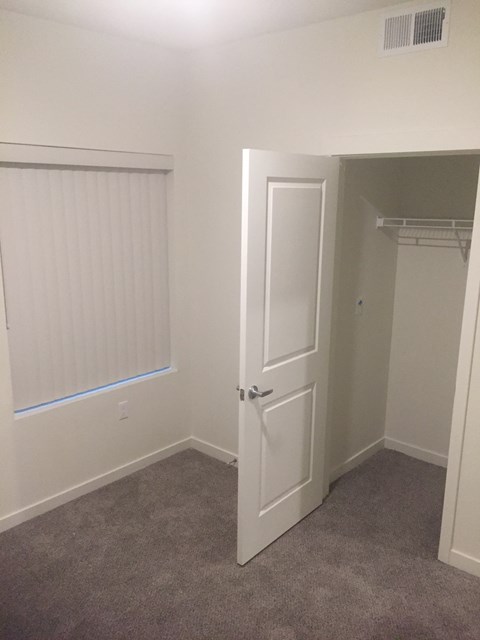 Bedroom with a carpet floor and closet