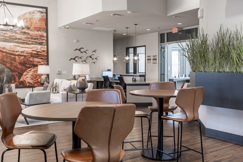 leasing center with tables and chairs in a hotel lobby