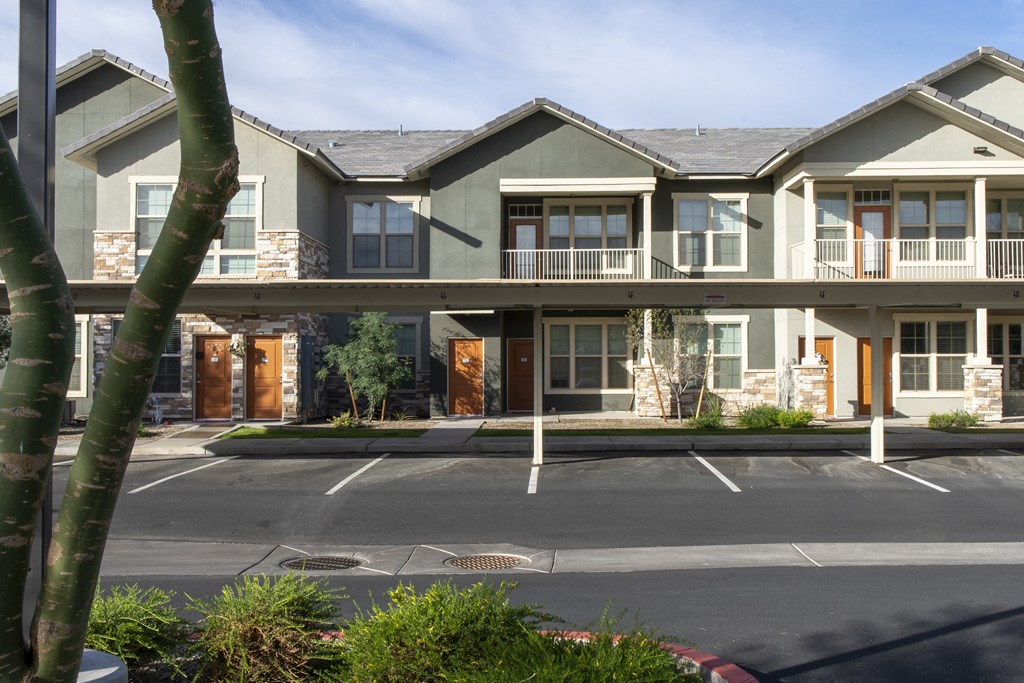 a street view of a building with covered parking